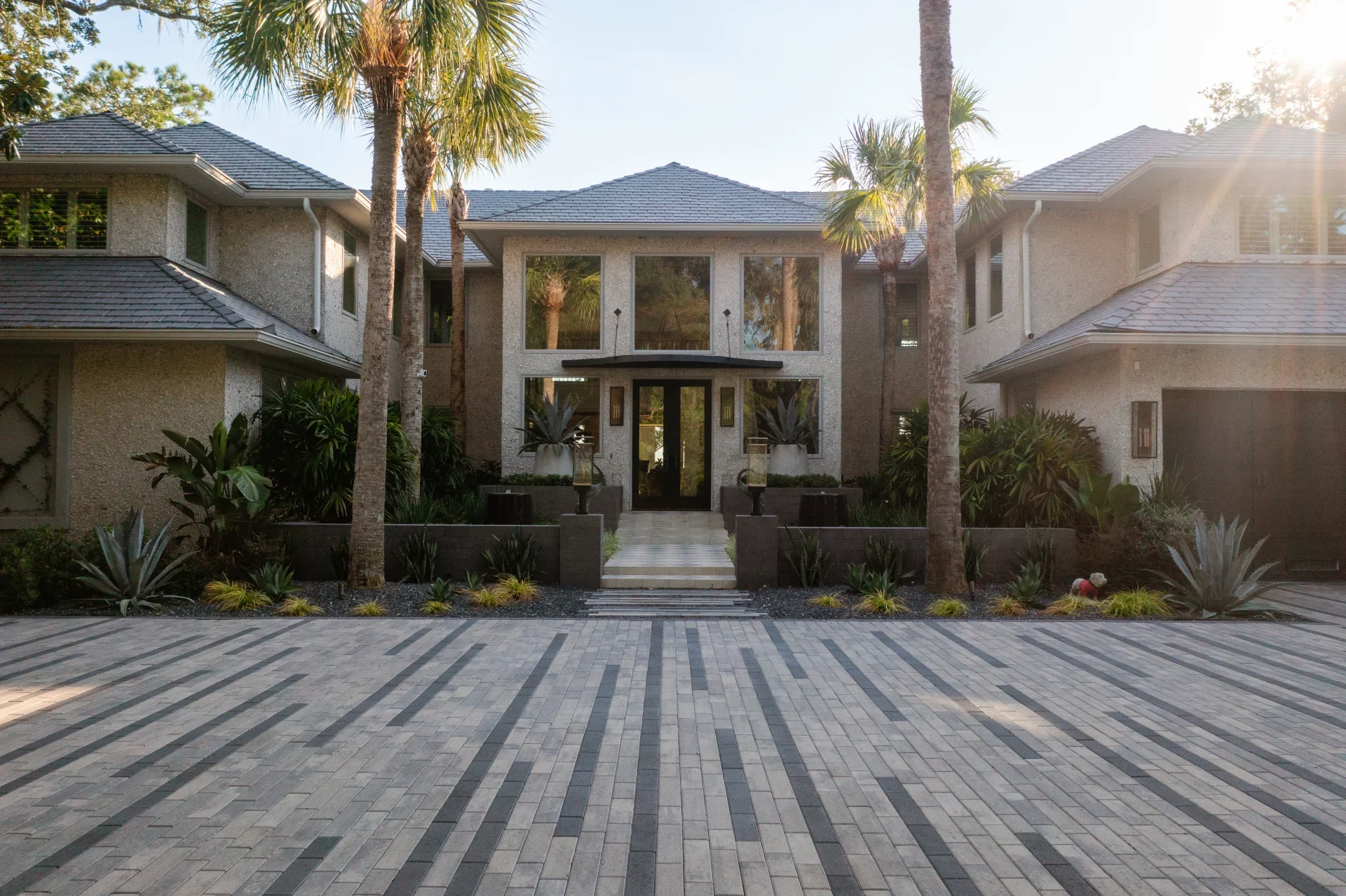 Sea Island residence with palm-lined stone courtyard